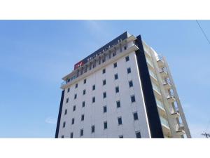 a tall building with a sign on top of it at My Hotel Okazaki - Vacation STAY 40799v in Okazaki