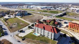 an aerial view of a building in a city at La Quinta by Wyndham Fort Worth - Lake Worth in Fort Worth