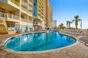 a swimming pool in the middle of a resort at Bay Watch Resort in Myrtle Beach