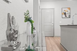 a kitchen with a sink and a vase with plants at Tropicana Field 1 Bed in Downtown St Pete With Free Parking in St Petersburg