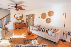 a living room with a couch and a table at Heron Hideaway in Folly Beach