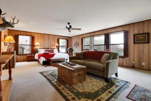 a living room with a couch and a bed at Ridge - A Birdy Vacation Rental in Kerrville