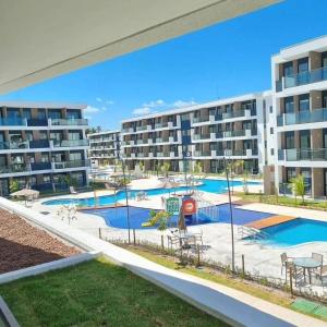 a view of an apartment complex with a pool at Muro Alto-Porto de Galinhas Flat Makia 104D in Ipojuca