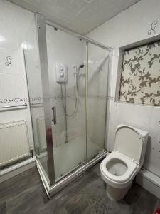a bathroom with a shower and a toilet at Inviting 2-Bed House in Birmingham in Birmingham