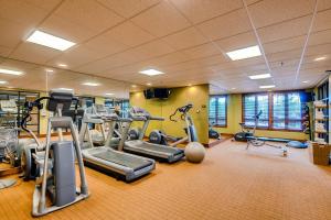a gym with treadmills and ellipticals in a room at BlueSky Breckenridge in Breckenridge
