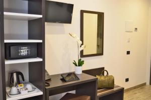 TV a/nebo společenská místnost v ubytování Hotel Luxor Florence