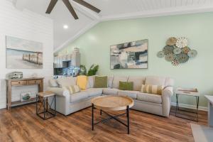a living room with a couch and a table at Solitude on 30A - Seacrest Beach Townhouse with Beach Access - FREE BIKES in Rosemary Beach
