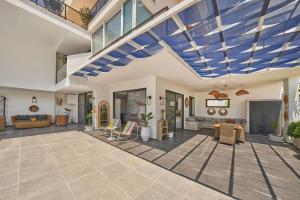 a large living room with a blue ceiling at Villa Rio in Kalkan