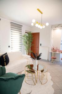 a living room with a couch and a table at SeaView Luxury Suite in Alexandroupoli