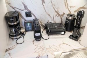 a counter top with a coffee maker and a blender at SeaView Luxury Suite in Alexandroupoli