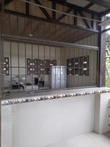a view of a building with a display case at Casa Lapas. in Aguas Zarcas