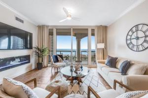 a living room with a couch and a table at Portofino Island P2-905 in Pensacola Beach