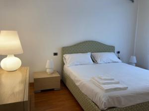 Ein Bett oder Betten in einem Zimmer der Unterkunft Una Villa a Torino