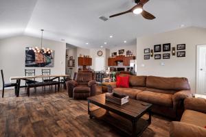 a living room with a couch and a table at Speakeasy - A Birdy Vacation Rental in San Antonio