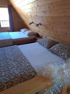 Llit o llits en una habitació de Holiday Home Ella Mokra Gora - Apartman Ella
