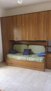 Ένα ή περισσότερα κρεβάτια σε δωμάτιο στο Villa Marinella