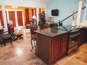 a kitchen with an island in a living room at Lakefront Casita - Perfect for couples or families in Hot Springs