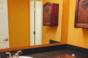 a bathroom with a sink and a mirror at Lakefront Casita - Perfect for couples or families in Hot Springs