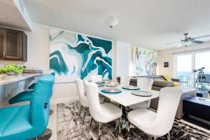 a dining room with a table and chairs at Unit 203 Aruba - 3 Bedroom Ocean Front in Daytona Beach