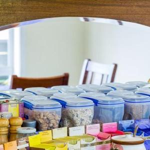 a table with many jars of food on it at Annabells B&B in Whitianga