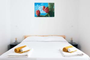 Ένα ή περισσότερα κρεβάτια σε δωμάτιο στο Terrazza sul Mercato. Your house in Ballarò