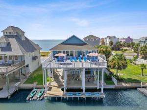 an aerial view of a house on the water at Fun, Fish, Crab, Birds, Beach & incredible Sunsets in Galveston