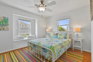 a bedroom with a bed and a window at Fun, Fish, Crab, Birds, Beach & incredible Sunsets in Galveston