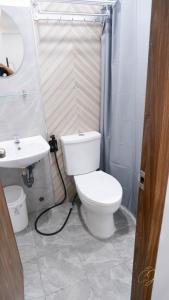 Koupelna v ubytování CJ Apartments