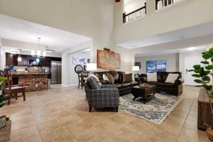 a large living room with couches and a kitchen at Wanderlust - A Birdy Vacation Rental in San Antonio