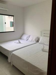 Posteľ alebo postele v izbe v ubytovaní Casa Primavera aluguel temporada