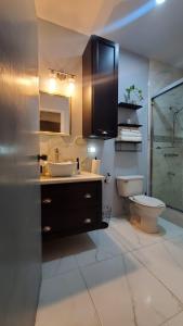 a bathroom with a sink and a toilet at The shores in Montego Bay
