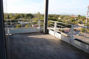 a balcony with a view of a city at Departamento entero de lujo in Los Mochis