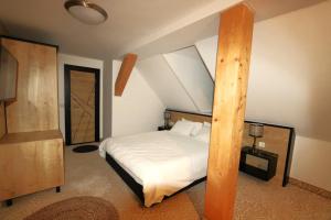 Кровать или кровати в номере Am Fluss Saale