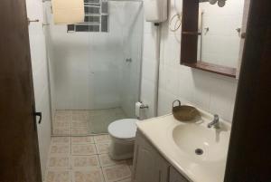 a bathroom with a sink and a toilet at Apartamento 03 br 290 restaurante Le Sorelle in Rosário do Sul
