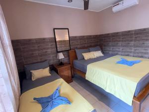 Postel nebo postele na pokoji v ubytování Lita Homestay