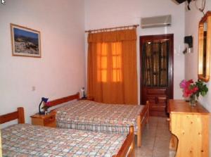 Llit o llits en una habitació de Studios Irene