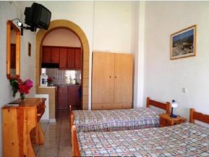 Llit o llits en una habitació de Studios Irene