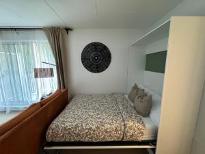 a bedroom with a bed and a window at Beautiful and cozy new condo in downtown in Montreal