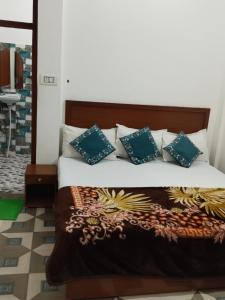 Ένα ή περισσότερα κρεβάτια σε δωμάτιο στο Rani Homestay