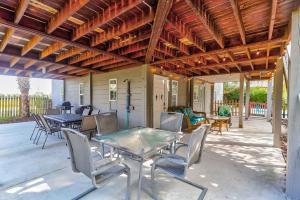 a patio with a glass table and chairs at 600 Palm Boulevard in Isle of Palms