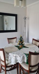 a dining room table with a christmas tree on it at Arica verano y surf Dpto completo 2 habitaciones in Arica