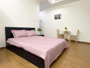 Postel nebo postele na pokoji v ubytování Cali Homestay