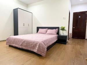 Postel nebo postele na pokoji v ubytování Cali Homestay