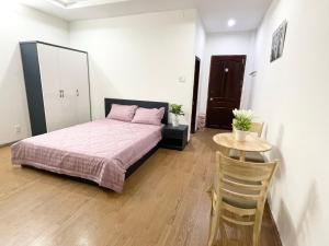 Postel nebo postele na pokoji v ubytování Cali Homestay