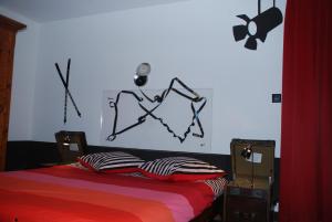 Letto o letti in una camera di Hostellerie de Genève