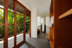 an open door to a room with a garden at Villa Amita by Nakula in Kerobokan