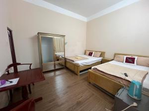 Ένα ή περισσότερα κρεβάτια σε δωμάτιο στο Homestay Ba Doan 2