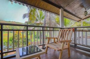 En balkon eller terrasse på Obrigado Cottages