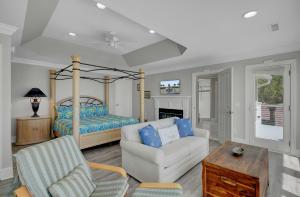 a living room with a couch and a bed at 910 Ocean Boulevard in Isle of Palms