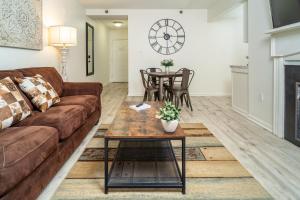 a living room with a couch and a table at Condo in Gatlinburg very peaceful - 10 min Walk to Main Strip in Gatlinburg